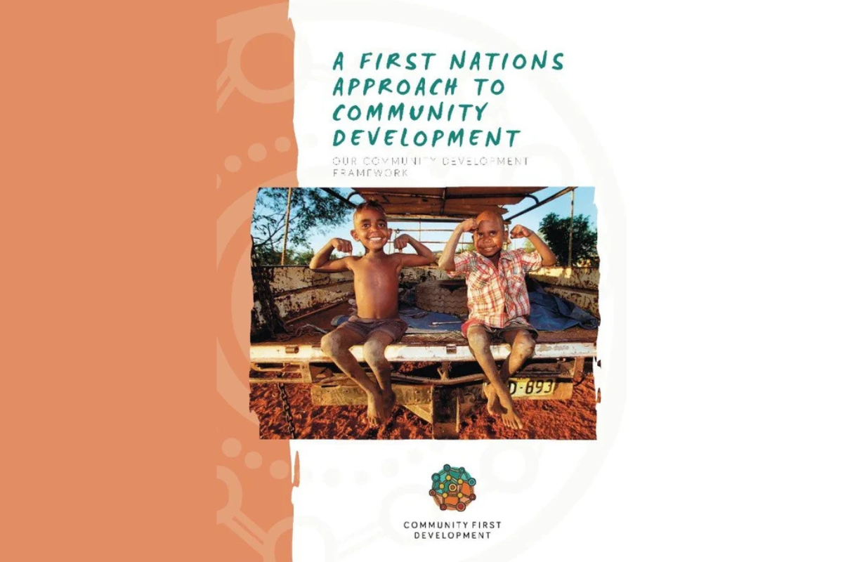 Cover page titled “A First Nations Approach to Community Development” with two children flexing muscles.